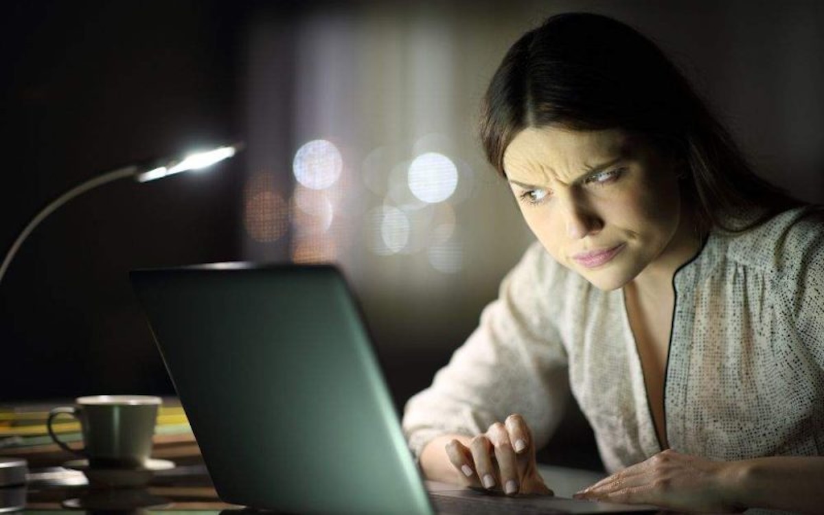 An empty modern office workspace with computers on representing vacant non-existent ghost jobs